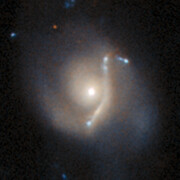 An anomaly from Hubble’s archive — Gravitational lens 1