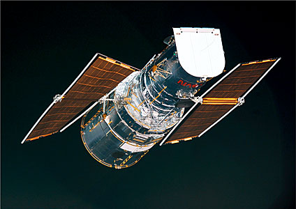An overview of the two ESA solar arrays just before they were rolled up during Servicing Mission 3B