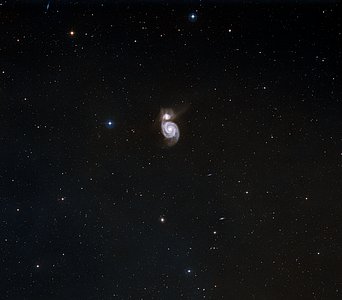 The Whirlpool Galaxy (M51a) with it's sparkling arms is the first galaxy found to have a spiral structure.