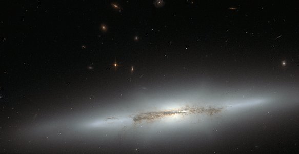 Hubble looks at sideways NGC 4710 (full)