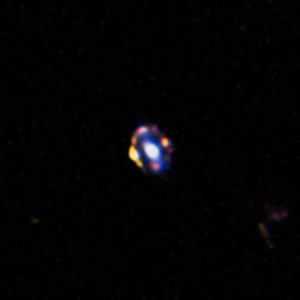 The most distant gravitational lens yet discovered