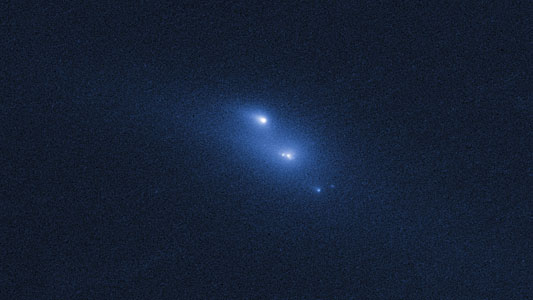 Disintegrating asteroid P/2013 R3 as viewed by Hubble on 29 October 2013
