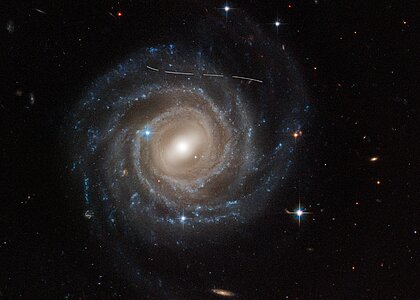 Asteroid photobombs Hubble snapshot of Galaxy UGC 12158