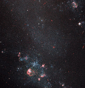 Faint galaxy with popping pink features