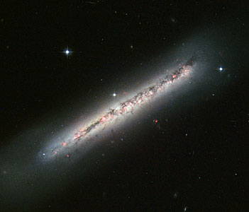 Glowing gas and dark dust in a side-on spiral
