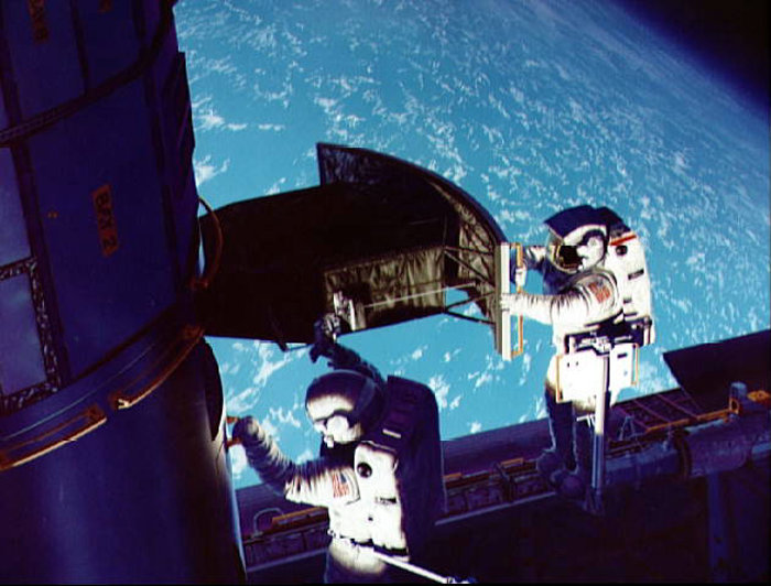 SM1: Artist Rendition of Astronauts on the Job