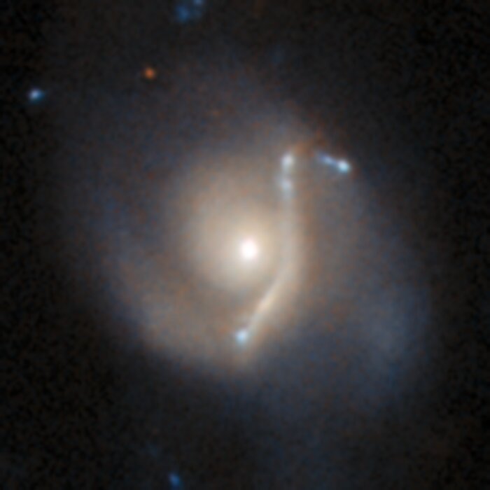 An anomaly from Hubble’s archive — Gravitational lens 1
