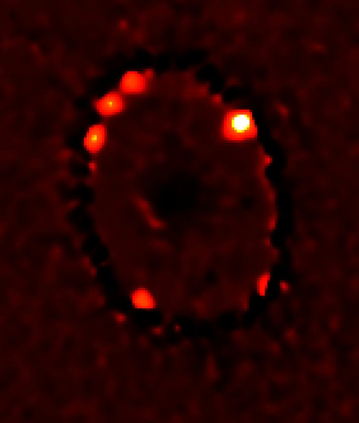 Four Bright Knots of Superheated Gas in Supernova 1987A Ring