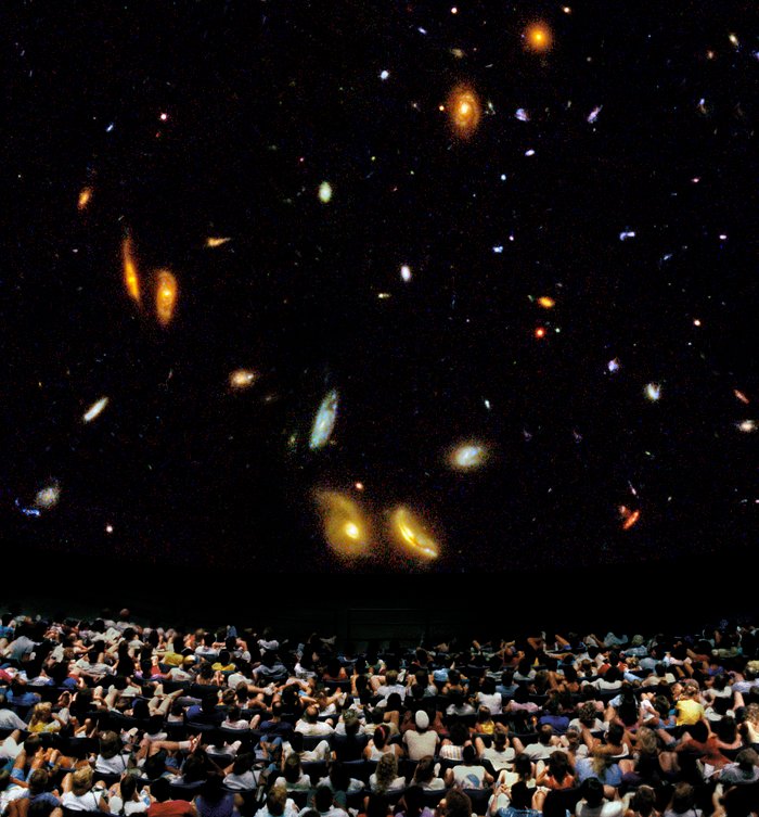 Audience viewing award-winning Hubble IMAX film (photo illustration)