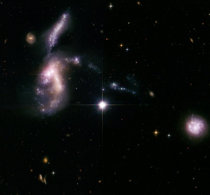 Hickson Compact Group 31: interacting galaxies glow with millions of young stars