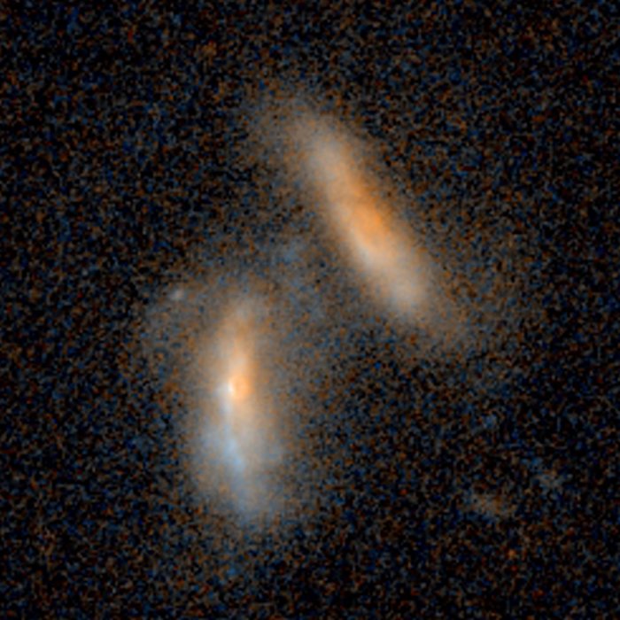 Merging galaxies — 2.4 billion light-years from Earth