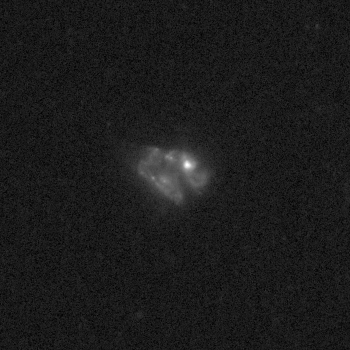 Outflows from merging galaxy J1558+3957