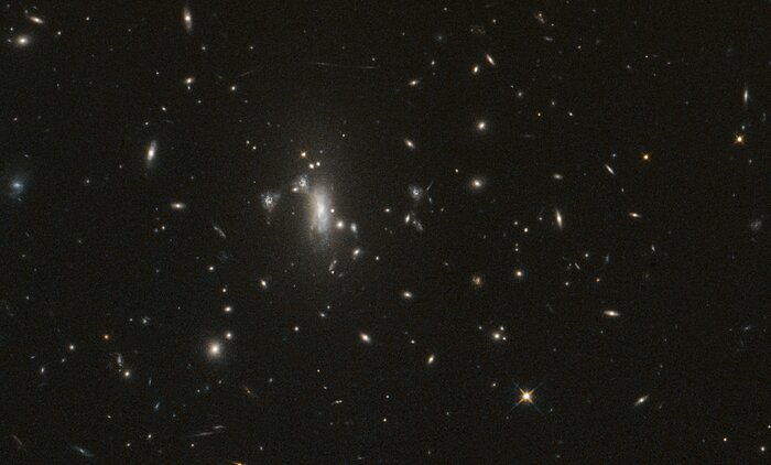 Hubble seeks lensed supernova, marks 200,000 orbits