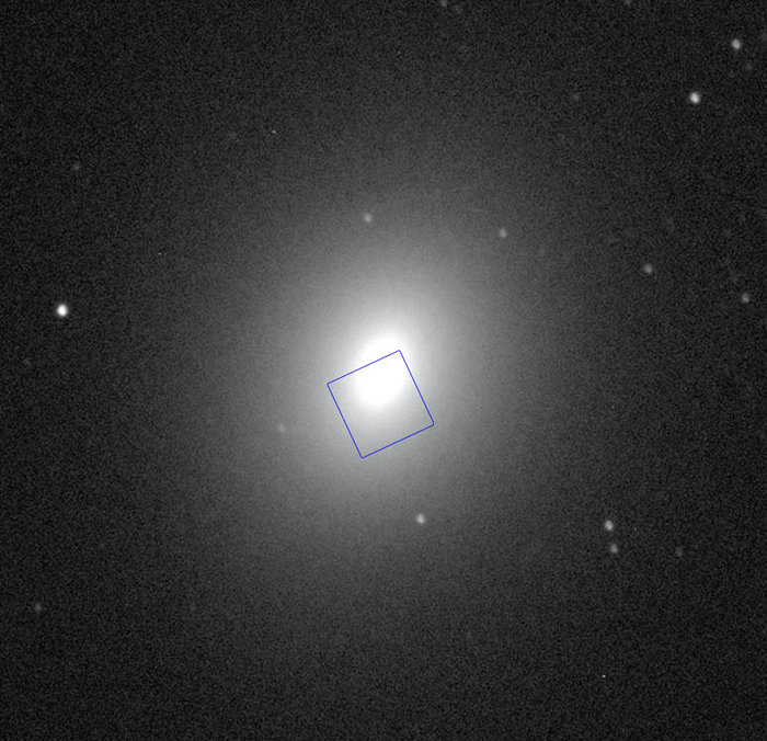 Ground-based image of M32 with the STIS field outlined.